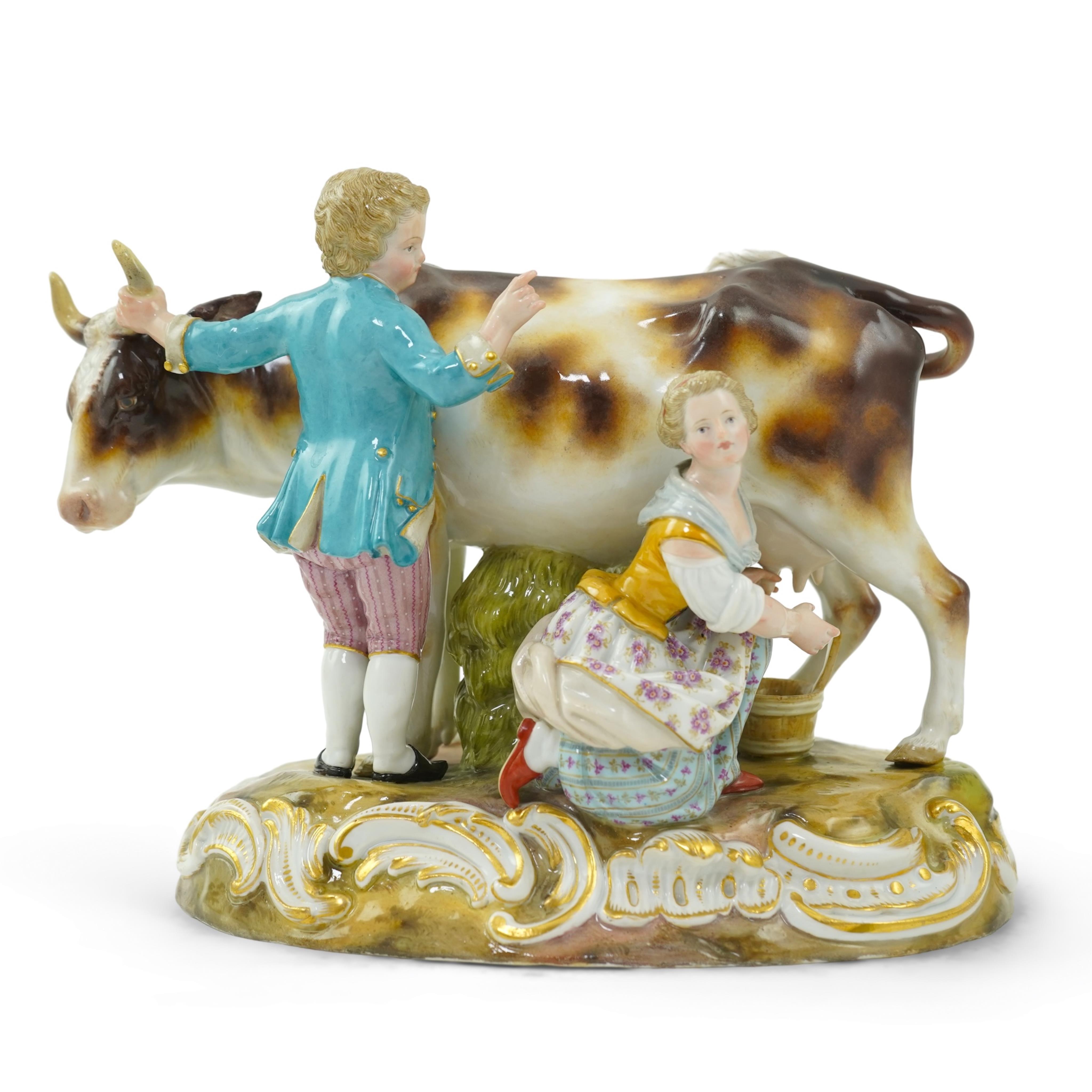 A Meissen group of a boy and girl milking a cow, 19th century